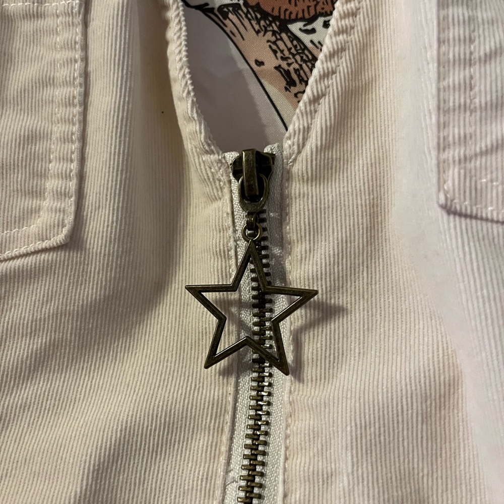 Halter shorts jumpsuit with star keychain zip up in the front. - Picture 4 of 7